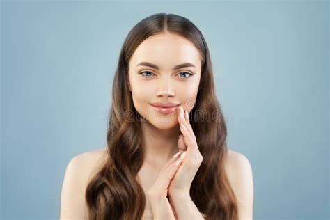 Lovely Model Woman With Clear Skin On Blue Background Stock Image