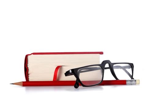 Premium Photo Close Up Of Eyeglasses On Book Against White Background