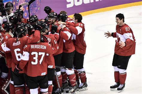 watch canadians celebrate men s hockey gold medal win against sweden globalnews ca