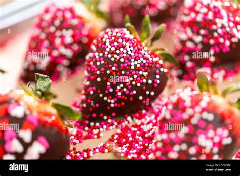 Chocolate Dipped Strawberries Covered With Sprinkles Stock Photo Alamy