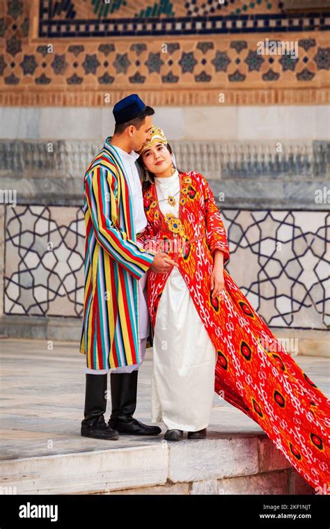 Samarkand Uzbekistan April 18 2021 Bride And Groom In Traditional Uzbek Dresses At Registan