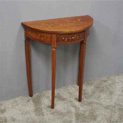 A stunning inlaid console table, in the antique sheraton style, which i would date from around the 1950's period. Antique Sheraton Style Bow Front Hall Table | ANTIQUES.CO.UK