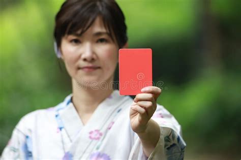 Yukata Woman Issuing A Red Card Stock Photo Image Of Asia Young