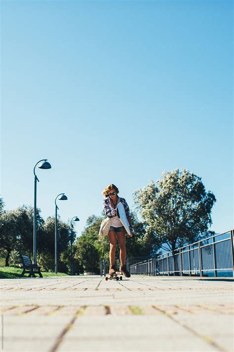 Girl Going With Longboard Holding Her Surfboard By Stocksy Contributor Michela Ravasio