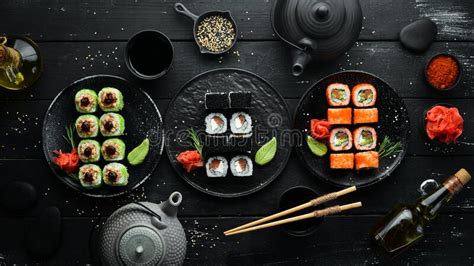 Set Of Colored Sushi In Black Plates Japanese Food Stock Photo Image