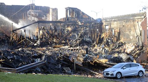 Fire destroys historic De Pere building, displaces more than 20 people