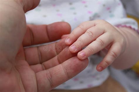 The Hand Of The Child Holds A Hand Of The Adult Stock Image Image Of
