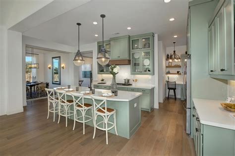 From the accents to the artwork, here are tips to reinvigorate the kitchen, without breaking the bank. Drees Custom Homes kitchen with pocket office, white ...