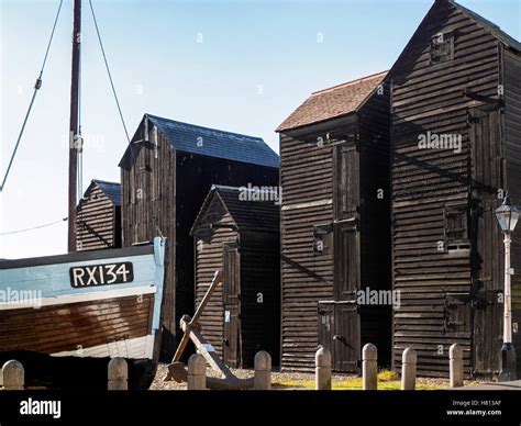 Fishermens Sheds And Boat In Hastings Stock Photo Alamy