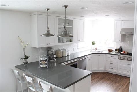 The gray tile backsplash also serves as good contrast to the whiteness of the space. Pin on dream house
