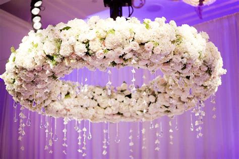 Floral Chandelier At Wedding Reception With Delicate Hanging Crystals