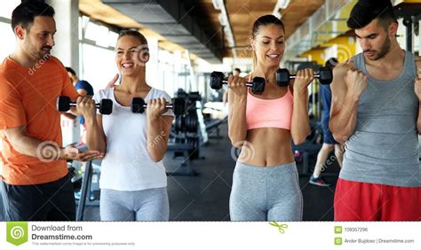 Group Of Friends Exercising Together In Gym Stock Photo Image Of