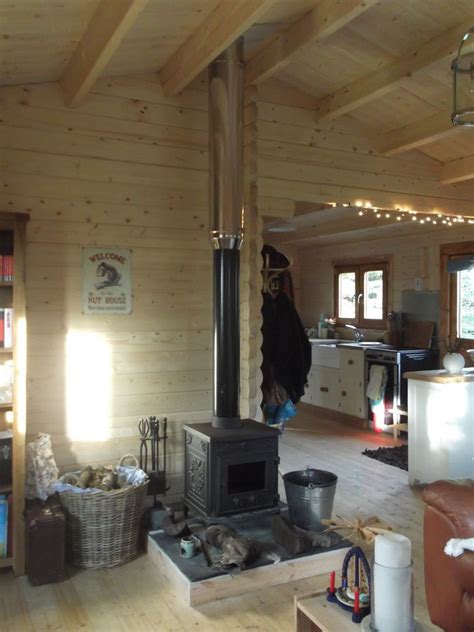 This year rain as managed to penetrate through the timber. Can I install a wood burning stove in my log cabin ...