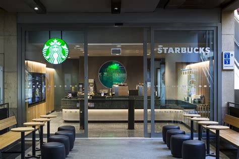 Here is a sophisticated white kitchen by turek design. Starbucks launches new concept café for "busy London ...