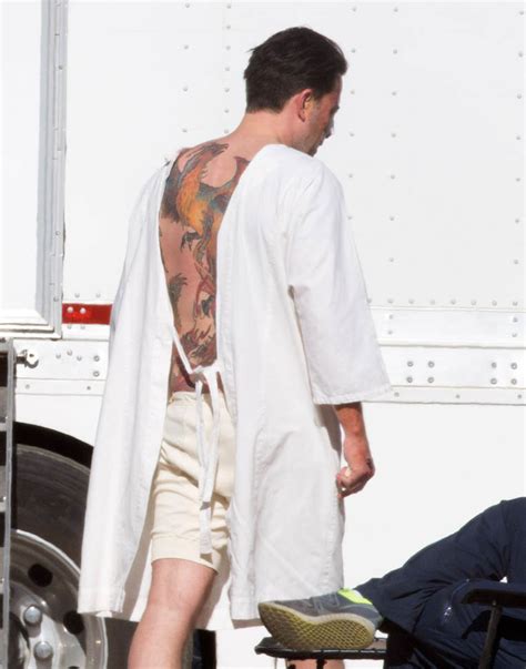 Ben affleck's back tattoo is, and i'm saying this without hyperbole, one of the funniest goddamn things i've ever seen in my entire life. Ben Affleck on set of Live By Night with giant back tattoo ...