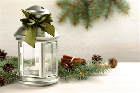 Christmas Lantern With Burning Candle And Fir Tree Branch On White
