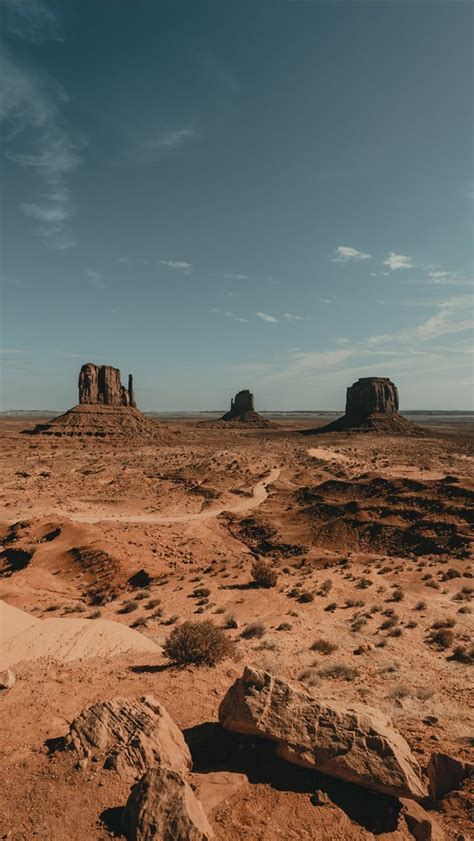 Brown Rock Formation Under White Clouds During Day Iphone Wallpapers