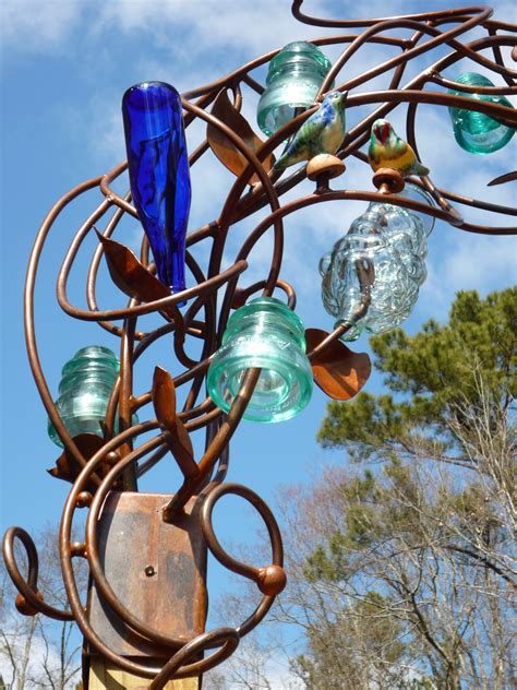 Bottle Tree Arch With Wolf Pottery Birds Perching Stephaniedwyer