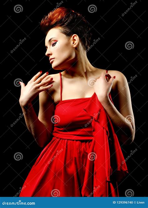 Sensual Young Lady In Red Dress Posing An Studio Beauty Fashion