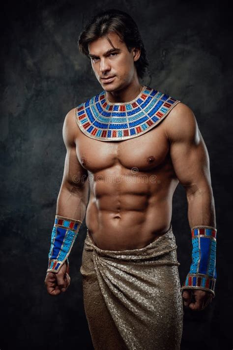 Athletic Man In Egyptian Costume Performing His Feats Of Strenght Stock Image Image Of