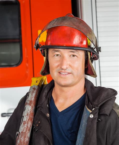 Male Firefighter Rescued A Child And A Toy Stock Photo Image Of