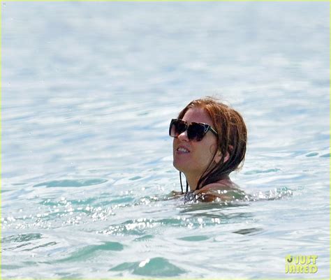 Isla Fisher Wears Pink Bathing Suit During Beach Day With Sacha Baron Cohen In Barbados Photo