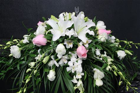 A Beautiful Lily And Rose Casket Spray Funeral Flower Arrangements