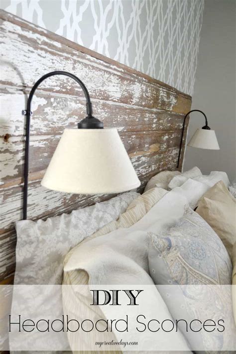Rough edges and uneven placement give the headboard a rustic look. DIY Headboard Sconces - My Creative Days