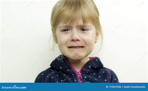 Portrait Of Little Child Girl Crying With Tears On Her Eyes White