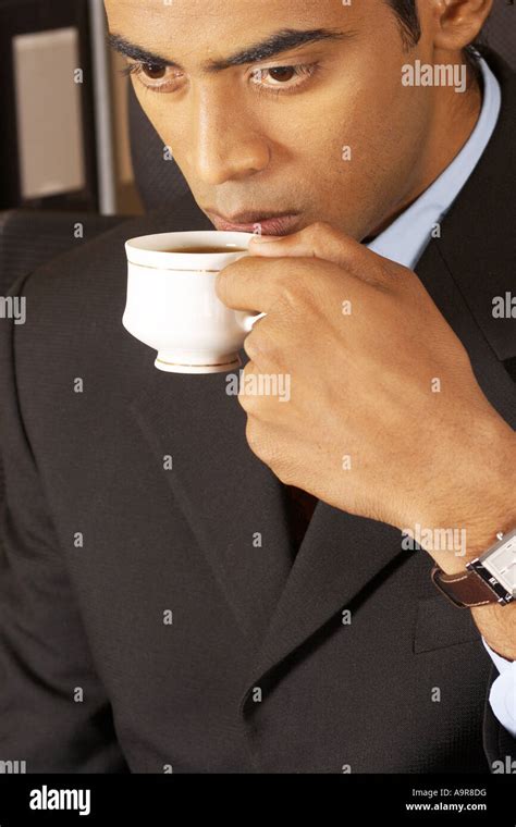 An Executive Sipping Tea Stock Photo Alamy