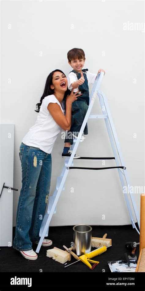 Cheerful Little Boy Climbing A Ladder Stock Photo Alamy