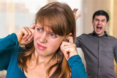 Couple Arguing Angry Man Screaming At His Wife At Home Stock Image