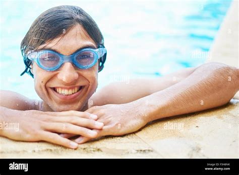 Portrait Of Young Man Wearing Goggles In Swimming Pool Stock Photo Alamy