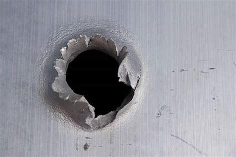 Bullet Hole Pictures Images And Stock Photos Istock