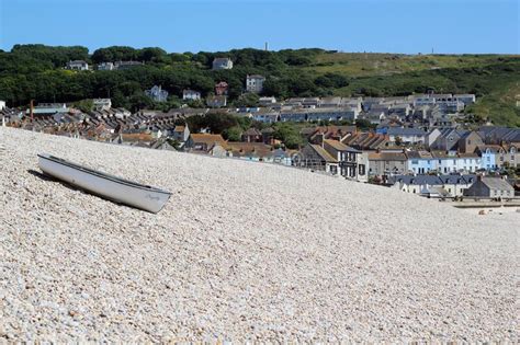 Landscape View Of A Fishing Boat On Chesil Beach Portland Weymouth