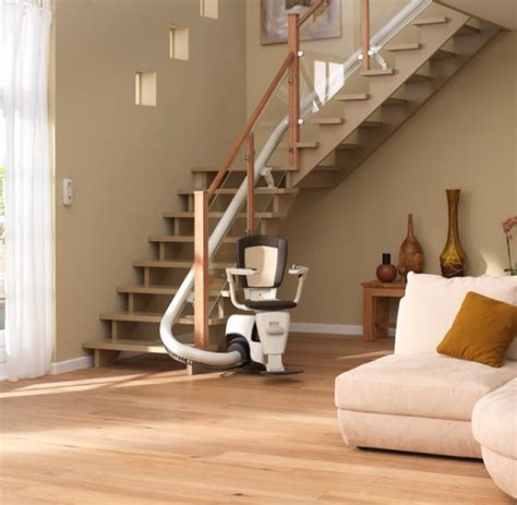 The electric stair lift, also called lift or stair lift, consisting of a power chair in which a person sits up or down the stairs in a house. Wheelchair Assistance | Wheel chair stair lifts
