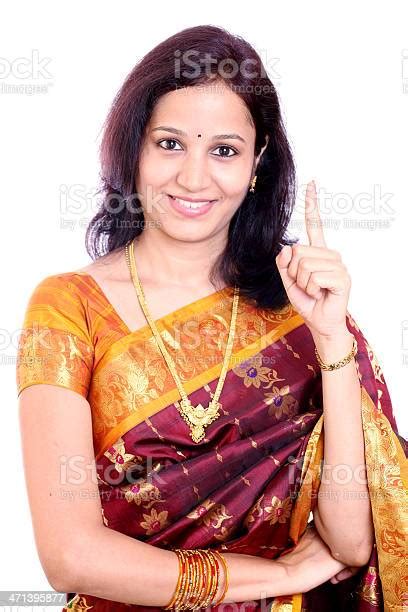 Happy Indian Woman Holding Her Index Finger Up Stock Photo Download
