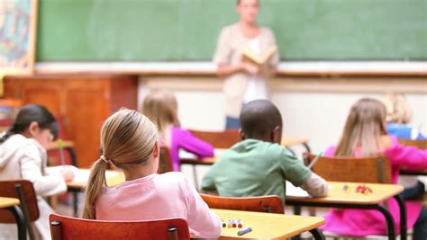 Track and manage assignments in your dashboard, grade work automatically, and help students when they get stuck. Cute Children Raising Their Fingers In The Classroom Stock ...