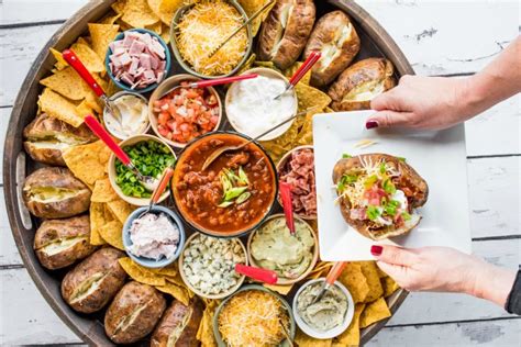 Place a charcuterie board down in front of people and they get to pick and choose what they like, making i love a simple charcuterie board. EPIC Baked Potato Dinner Board - Reluctant Entertainer