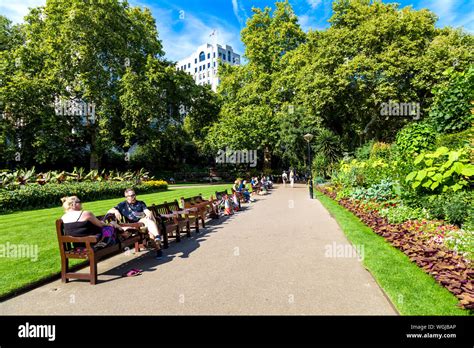 People Sitting On Benches Hi Res Stock Photography And Images Alamy
