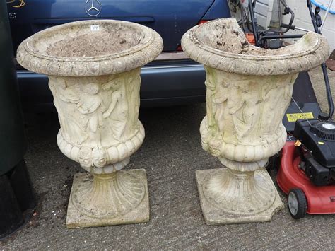 The pot and the pedestal. Pair of large concrete garden pedestal urn planters - one ...