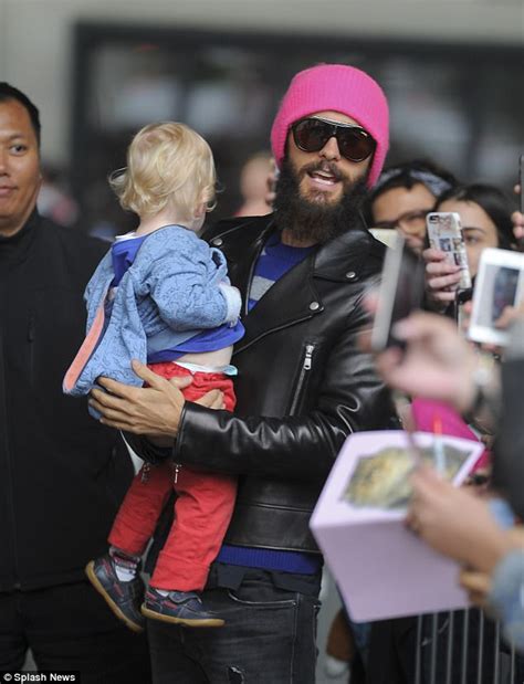 Jared Leto Cradles A Cute Child As He Heads To Radio 1 Daily Mail Online