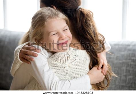 Cute Little Daughter Hugging Mother Holding Stock Photo Edit Now