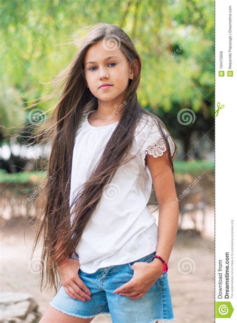 Beautiful School Girl With Long Hair In The Park Prety Girl Wi Stock Photo Image Of Green