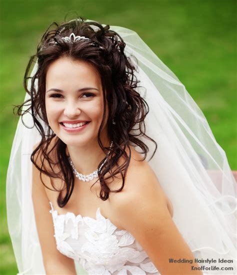 The woman with an oval face has the best of every world. Wavy Wedding Hairstyle with a Veil and Tiara - Knot For Life