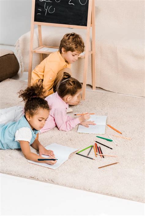Cute Multiethnic Children Holding Pictures And Stock Image Image Of