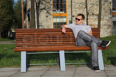 Person Sitting On Bench