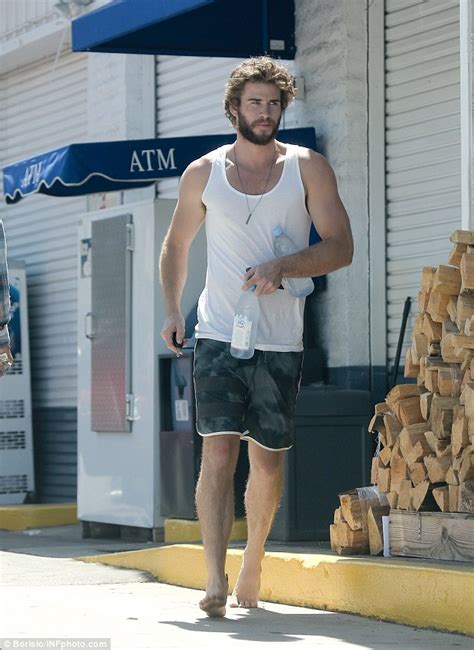 Liam Hemsworth Shops Barefoot While Ex Miley Cyrus Confesses She Still