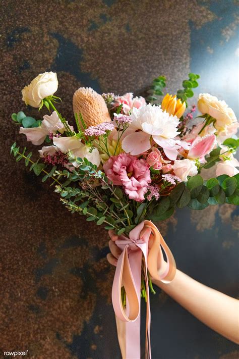 There's a person out there right now who holds a special spot in your heart! Download premium image of Woman holding a bouquet of ...