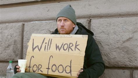 Homeless Man Beg For Money On The Street Sign On Cardboard Will Work
